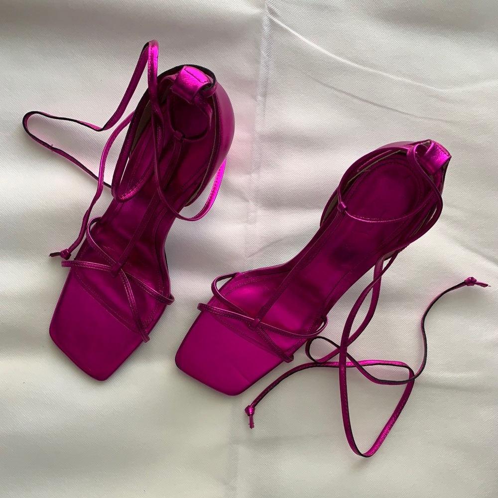 Metallic pink sandals.